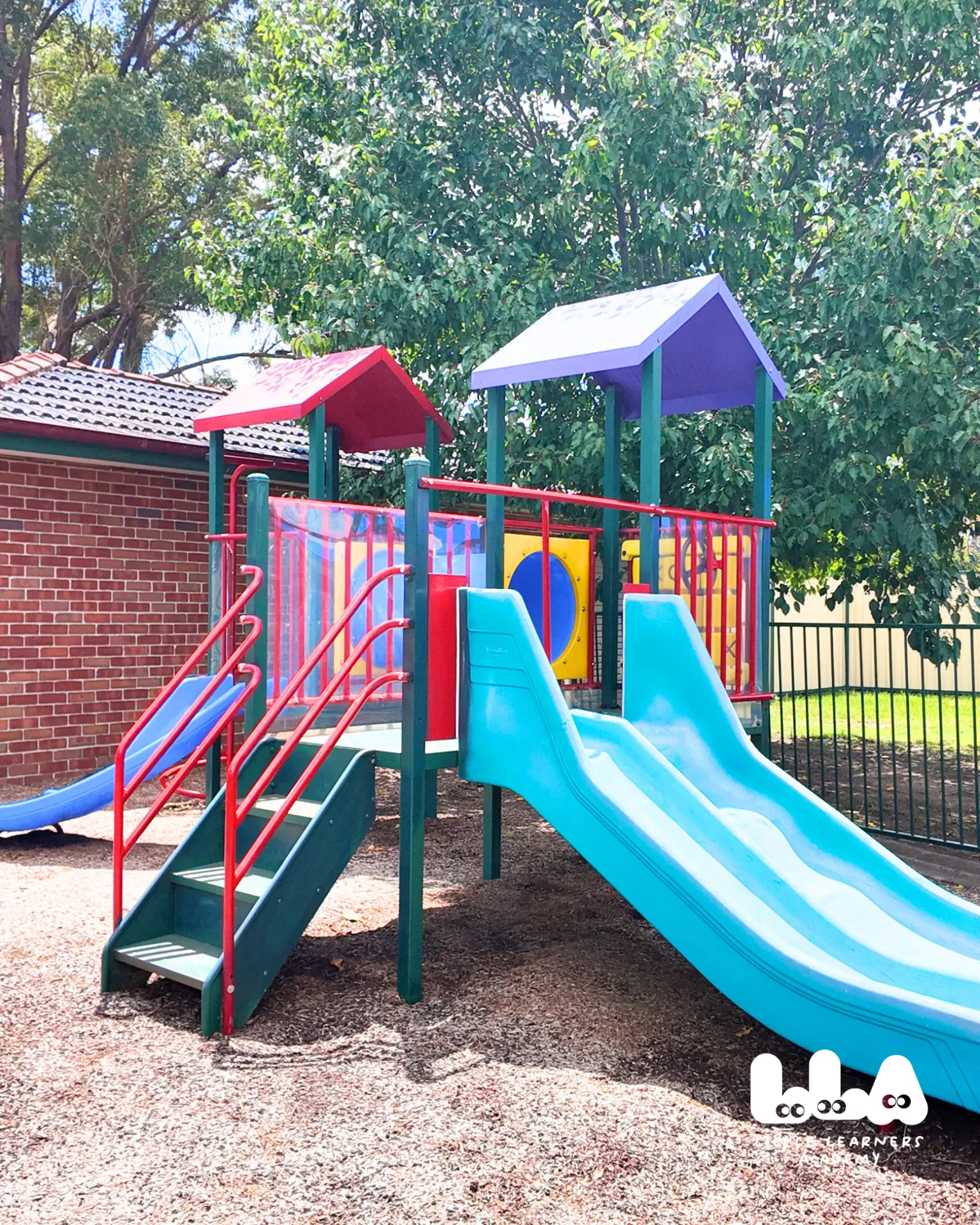 Colourful outdoor playground with slides at Little Learners Academy